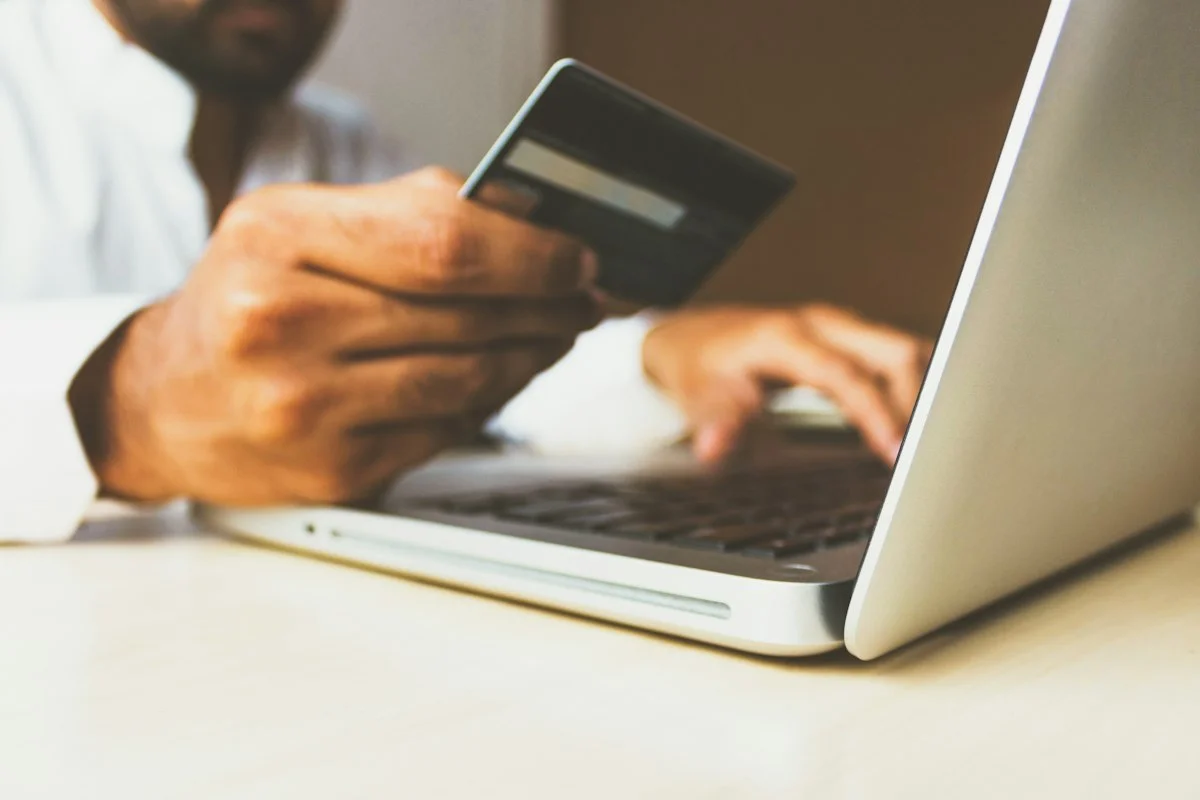 Professional managing digital payments and notary electronic billing on laptop